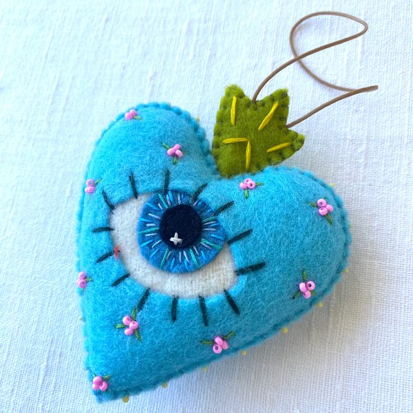 Beautiful the 'All-Seeing Heart' Ornament: A sea-blue heart ornament. - Image 5