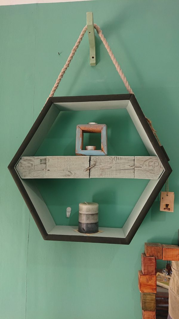 Hexagonal hanging display with pallet block shelf