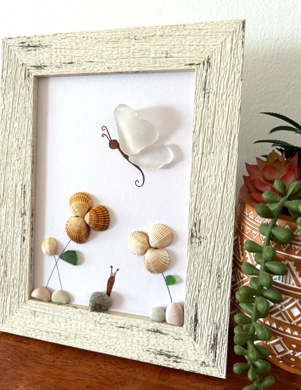 A lovely scene with a butterfly, snail, and flowers, made with seaglass and seashells, perfect as a unique gift! - Image 3