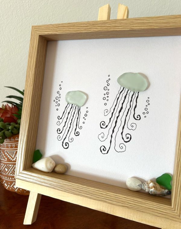 Two happy jellyfish made of seaglass swimming under the sea! Perfect sea inspired unique work!
