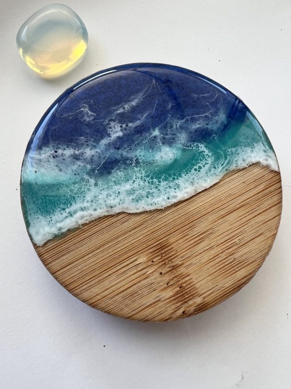 Ocean inspired resin and wood fridge magnet bottle opener.