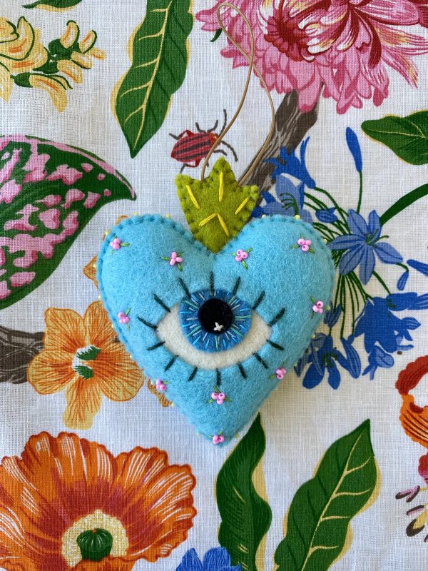 Beautiful the 'All-Seeing Heart' Ornament: A sea-blue heart ornament. - Image 6