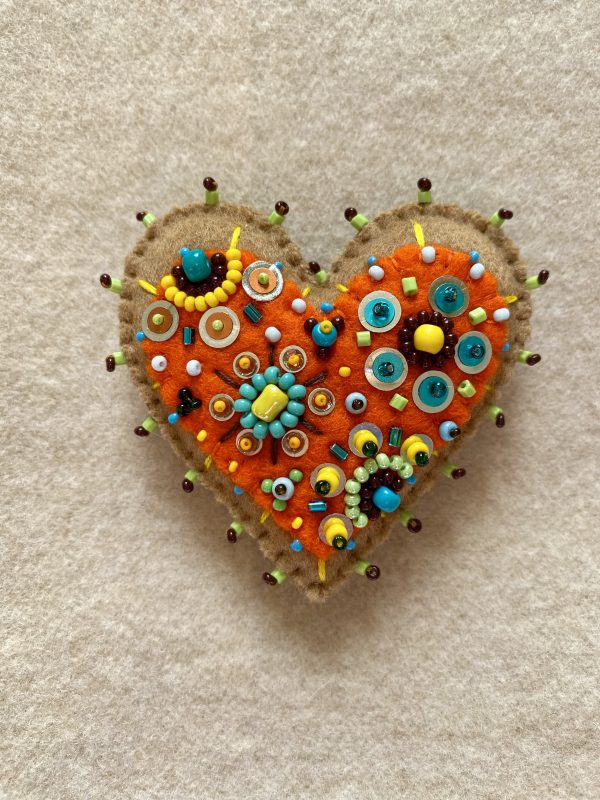 Adorable handmade orange heart magnet
