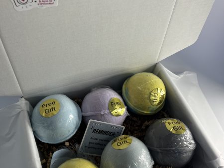 Box with bath bomb with toy inside