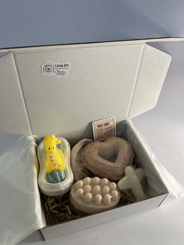Box with two bath bombs and one massage soap with loofh one soap for kids