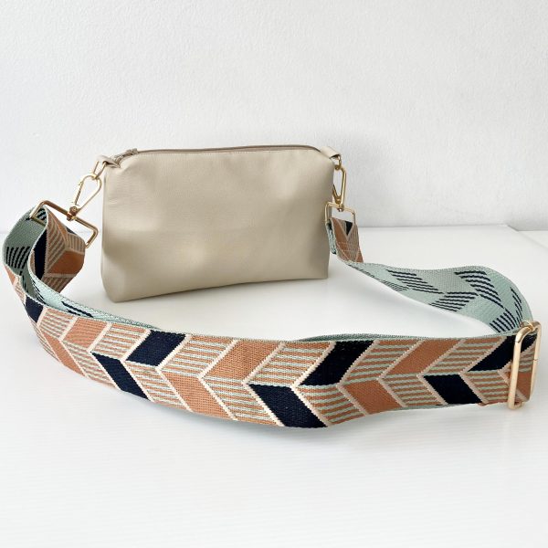 beige messenger bag with chevrons strap front