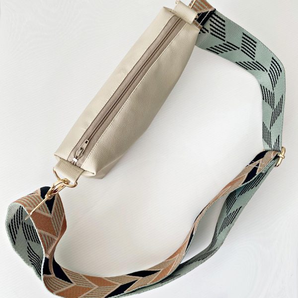 beige messenger bag with chevrons strap top