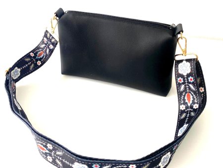 black messenger bag with bohemian strap front