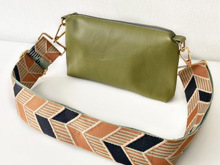 green messenger bag with chevrons strap front
