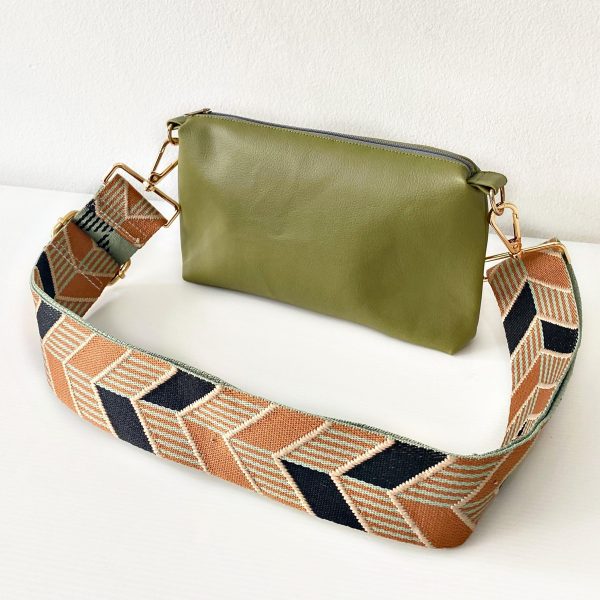green messenger bag with chevrons strap front