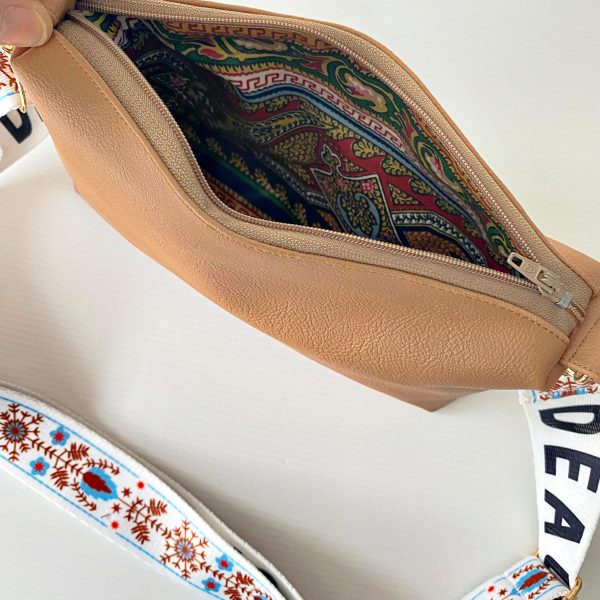 peach messenger bag with bohemian strap inside