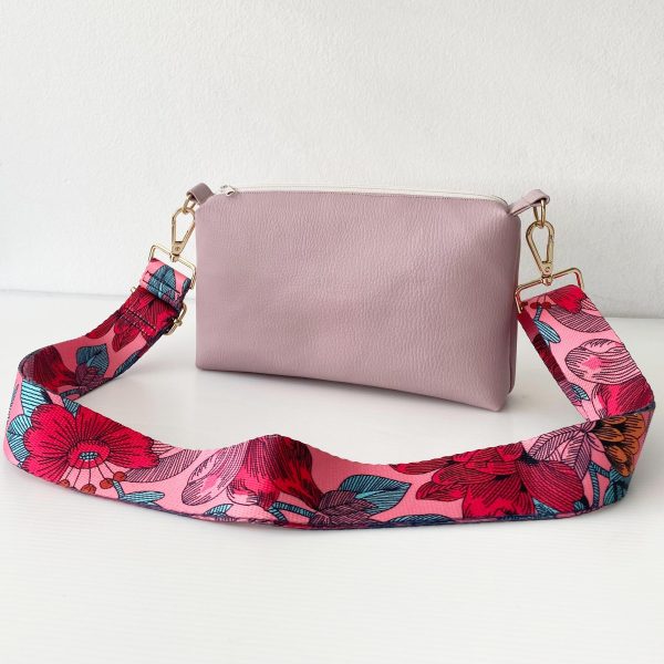 pink messenger bag with floral strap front