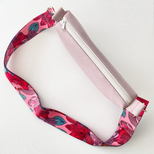 pink messenger bag with floral strap top