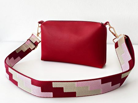 red messenger bag with geometric strap front