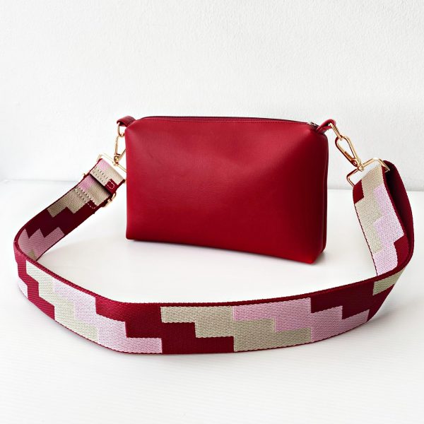 red messenger bag with geometric strap front